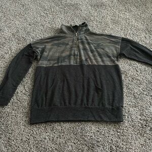 Small boutique quarter zip. Not sure of brand. Very soft